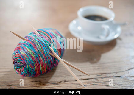 Yarn of colourful with knitting needle on wood, Bavaria, Germany Stock Photo