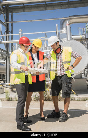 Engineer with his colleagues in meeting at geothermal power station, Bavaria, Germany Stock Photo