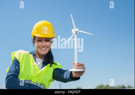 Female engineer showing wind turbine at geothermal power station, Bavaria, Germany Stock Photo