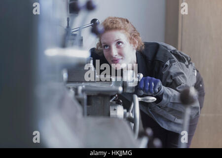 Young female engineer working in an industrial plant, Freiburg im Breisgau, Baden-Württemberg, Germany Stock Photo