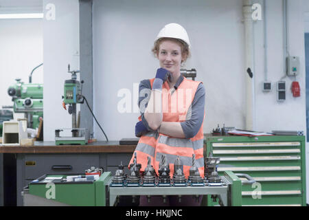 Young female engineer working in an industrial plant, Freiburg im Breisgau, Baden-Württemberg, Germany Stock Photo