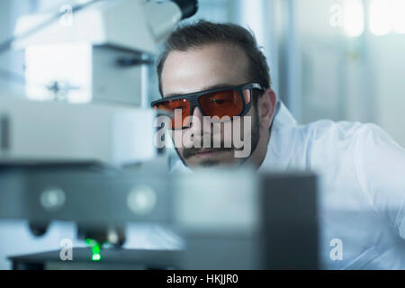Young male scientist working in technology space, Freiburg Im Breisgau, Baden-Württemberg, Germany Stock Photo