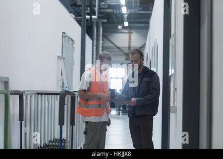 Store workers working in a distribution warehouse, Freiburg im Breisgau, Baden-Württemberg, Germany Stock Photo
