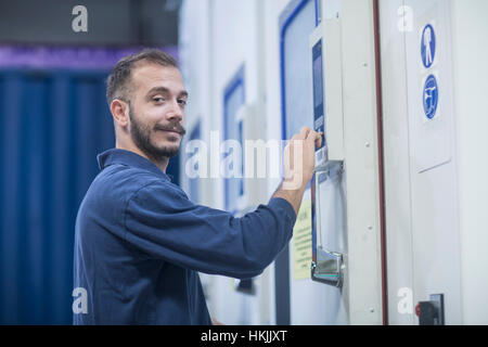Portrait of a store worker working in warehouse, Freiburg im Breisgau, Baden-Württemberg, Germany Stock Photo