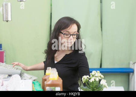 Young woman working in flower shop,Freiburg im Breisgau,Baden-Württemberg,Germany Stock Photo