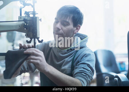 Shoemaker repairing shoe in a workshop, Freiburg im Breisgau, Baden-Württemberg, Germany Stock Photo