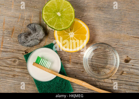 Baking soda, water, lemon, sponge, toothbrush and steel wool Stock Photo