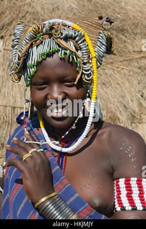 Mursi tribe people in traditional clothing, Mursi Village, South Omo, Ethiopia Stock Photo