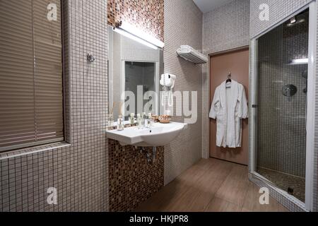 Fine hotel bathroom interior in beige color Stock Photo