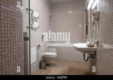 Fine hotel bathroom interior in beige and white Stock Photo