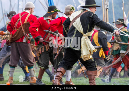 Cheshire, UK. 28th Jan, 2017. Holly Holy Day & Siege of Nantwich re-enactment. For over 40 years the faithful troops of The Sealed Knot have gathered in the historic town for a spectacular re-enactment of the bloody battle that took place almost 400 years ago and marked the end of the long and painful siege of the town. Roundheads, cavaliers, and other historic entertainers converged upon the town centre to re-enact the Battle. The siege in January 1644 was one of the key conflicts of the English Civil War. Stock Photo