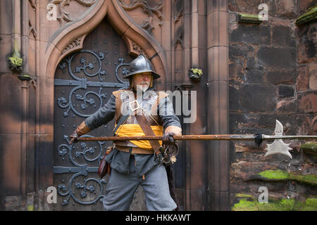 Halberdiers in Cheshire, UK. 28th Jan, 2017. Sergeant of the Parliamentarian Army holding a Halberd, halbard, halbert or Swiss voulge at Holly Holy Day & Siege of Nantwich re-enactment.The faithful troops of The Sealed Knot have gathered in the historic town for a spectacular re-enactment of the bloody battle that took place almost 400 years ago and marked the end of the long and painful siege of the town. Roundheads, cavaliers, and other historic entertainers converged upon the town centre to re-enact the Battle. The siege in January 1644 was one of the key conflicts of the English Civil War. Stock Photo
