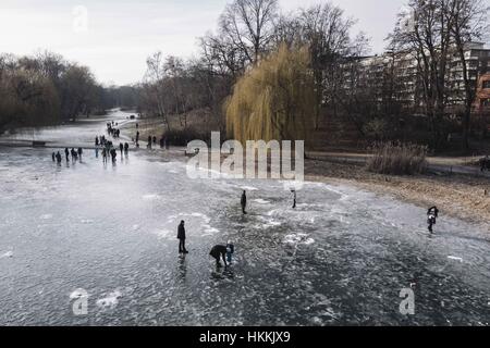 Berlin, Berlin, Germany. 29th Jan, 2017. People walk on a frozen lake in Schoeneberg. Due to the cold temperatures in January, a thin layer of ice has formed on the Berlin waters. Berlin Police say the ice on many lakes and rivers in the area is not safe to be on. Credit: Jan Scheunert/ZUMA Wire/Alamy Live News