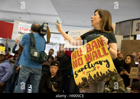 San Francisco, USA. 29th Jan, 2017. Protesters at San Francisco International Airport demand immediate release of refugees detained after Trump’s executive order banning citizens originally from seven Muslim majority countries from entering USA. Credit: Francesco Carucci/Alamy Live News. Stock Photo