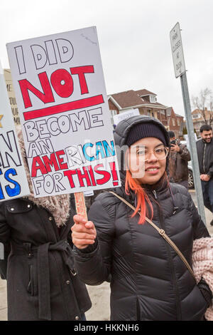 Hamtramck, USA. 29th January, 2017. Hundreds, including this naturalized citizen from Mexico, rallied at Hamtramck City Hall against President Trump's ban on immigration from seven Muslim nations. Hamtramck is a city of immigrants, a large number of whom are from Yemen. The city is governed by a Muslim-majority city council and is a sanctuary city. Credit: Jim West/Alamy Live News Stock Photo