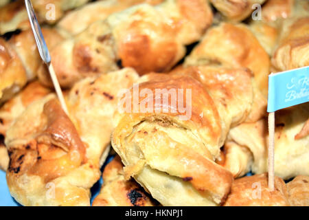 Savory croissants filled with ham, cheese and olives Stock Photo