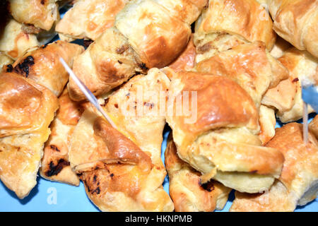 Savory croissants filled with ham, cheese and olives Stock Photo