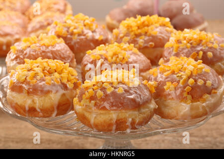 Traditional Polish homemade donuts with rose liqueur and orange Stock Photo