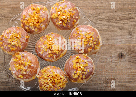 Traditional Polish homemade donuts with rose liqueur and orange and empty space for text Stock Photo