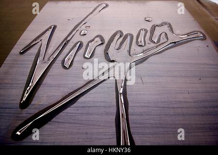 Distressed Virgin Railways sign on a carriage ready for being scrapped in Southall railway yard England Stock Photo
