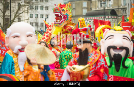 Performers await the start of the Chinese New Year parade in London, part of the Chinese New Year's celebrations to mark the beginning of the year of the Rooster. Stock Photo