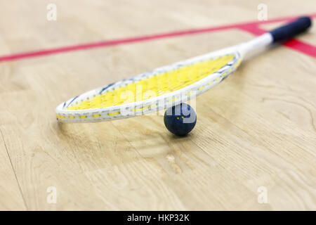 Closeup of squash racket and ball Stock Photo