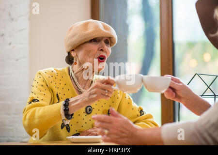 Senior women with coffee cups. Stock Photo