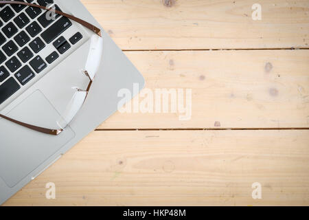 Wooden desk with various gadgets and accessories Stock Photo