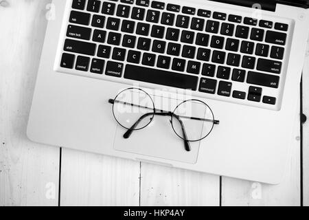 Wooden desk with various gadgets and accessories Stock Photo