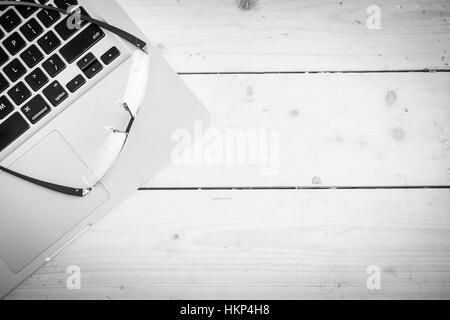 Wooden desk with various gadgets and accessories Stock Photo