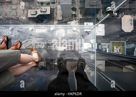 Birds eye view from the clear glass deck on top of a high rise building in Chicago, USA. Stock Photo