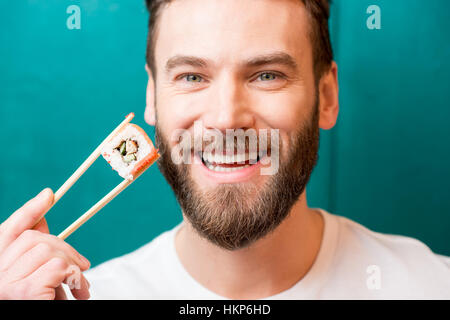 Man with sushi Stock Photo