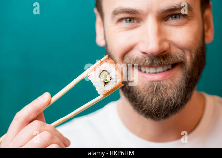 Man with sushi Stock Photo