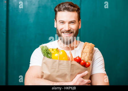 Man with bag full of food Stock Photo