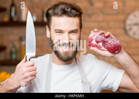 Man with meat Stock Photo