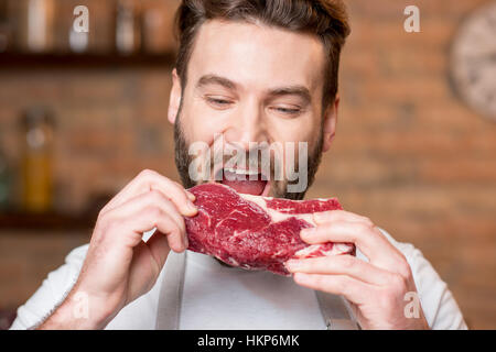 Man with meat Stock Photo