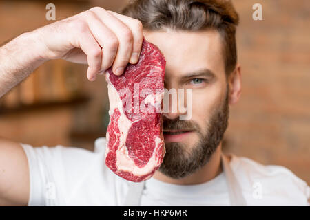 Man with meat Stock Photo