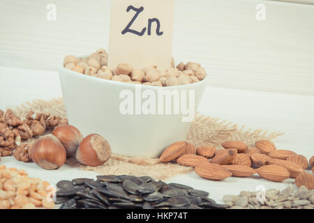 Vintage photo, Inscription Zn, Ingredients or products containing zinc and dietary fiber on white board, natural sources of minerals, Stock Photo