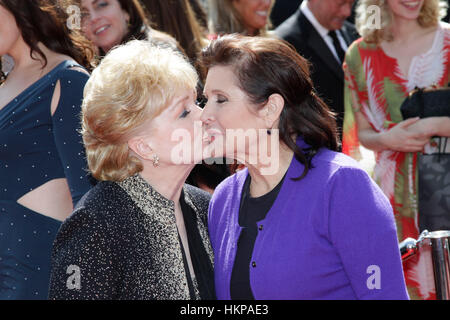 Debbie Reynolds and Carrie Fisher arrive for the 2011 Primetime Creative Arts Emmy Awards in Los Angeles, California on September 10, 2011. Photo by Francis Specker Stock Photo