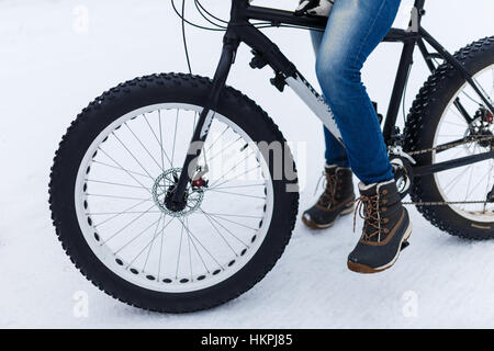 Human with bike in forest Stock Photo
