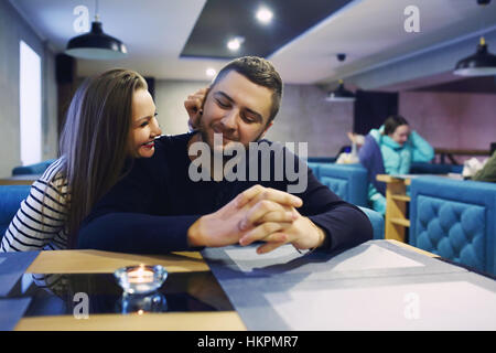 Two people in cafe enjoying the time spending with each other. Toned. Selective focus. Stock Photo