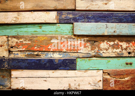 Old, grunge wood panels of used colourful wood pieces Stock Photo