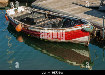 Small red Fishing Boat, named 'Adventure' in the Harbour of Scarborough on the North Sea coast of North Yorkshire, England Small red Fishing Boat, named 'Adventure' in the Harbour of Scarborough on the North Sea coast of North Yorkshire, England