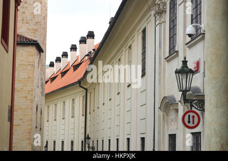 Historic Street with yellow buildings and lantern in Prague, Czech Republic Stock Photo