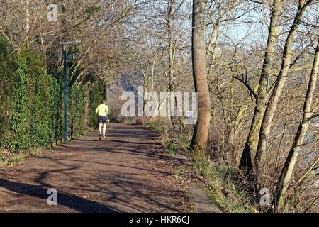 Runner on towpath at Richmond Surrey UK Stock Photo