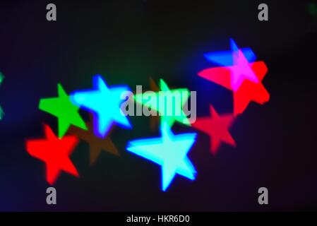 Abstract star patterns against dark background Stock Photo