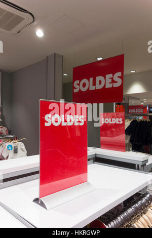 Soldes (sale) sign in clothing shop, Paris, France Stock Photo