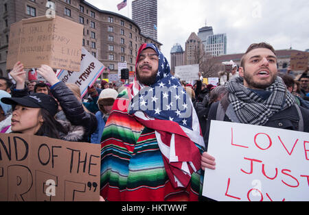 Boston, Massachusetts, USA. 29th January, 2017.  More than 20,000 demonstrators filled Copley Square in central Boston protesting President Donald Trump’s executive order stopped immigration from Iran, Iraq, Yemen, Somalia, Sudan, Libya and Syria to the United States.  Photo shows Izzy a 39 year-old American Citizen of Port Rican and Mexican decent wearing and American flag and a Mexican serape.   The demonstration in Copley Square was organized by the Massachusetts branch of the Council on American-Islamic Relations, CAIR.  Credit: Chuck Nacke/Alamy Live News Stock Photo