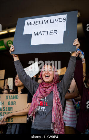 Los Angeles, California, USA. 29th Jan, 2017.  People with signs protesting President Trump's immigration ban at LAX Airport in Los Angeles, California, on January 29th, 2017. Credit: Jim Newberry/Alamy Live News Stock Photo