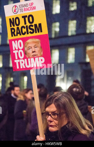 London, UK. 30th Jan, 2017. Hundreds protest outside the gates of Downing Street against an invitation by HM the Queen to US President Donald Trump for a State Visit, a date for which has still to be set. The protests come following Trump's executive Order for the temporary ban on Muslims and refugees from seven countries from entering the United States. A petition against the visit started following the ban has gathered well over a million signatures. Credit: Paul Davey/Alamy Live News Stock Photo